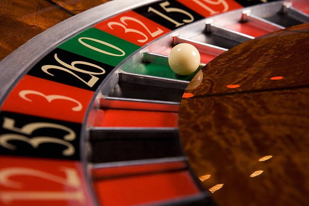 Mobile phone showing Monopoly Live betting interface and live dealer stream